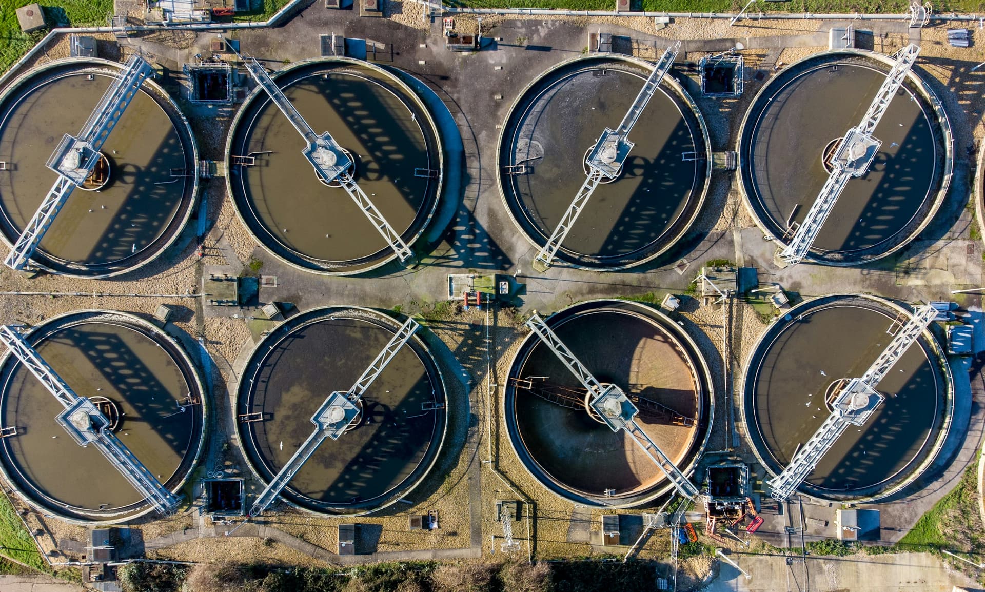 Aerial view of circular tanks at a wastewater treatment plant